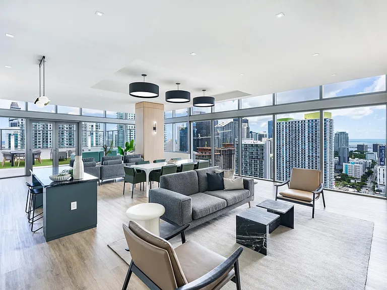 Sophisticated design and panoramic views define the 36th floor lounge at Modera Riverside.