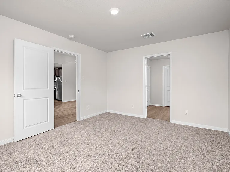 The master suite has a large bedroom, ensuite bathroom and walk-in closet.
