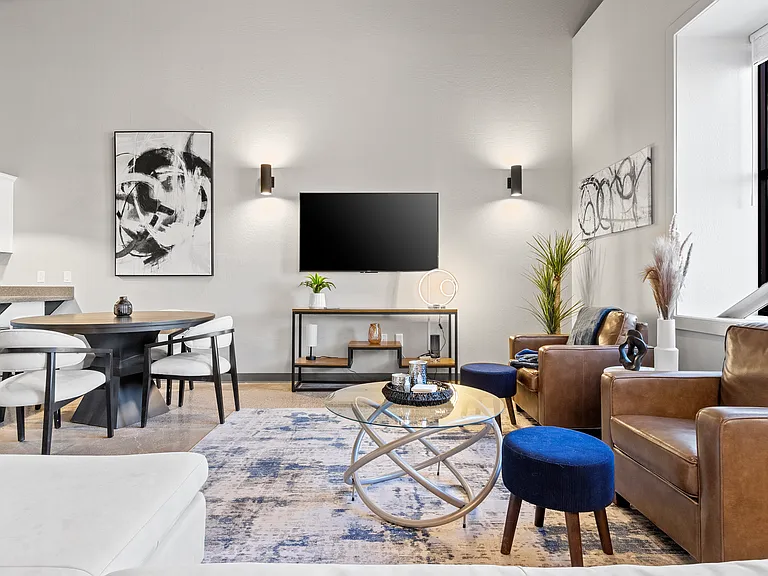 Urban penthouse vibes with 18' ceilings- proof that you don't have to live in a big city to live big.