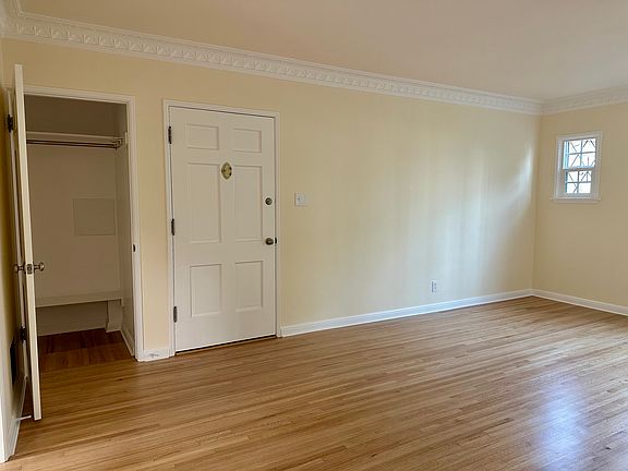 Living area - 3rd view - Walk in closet with a bench next to front door entrance