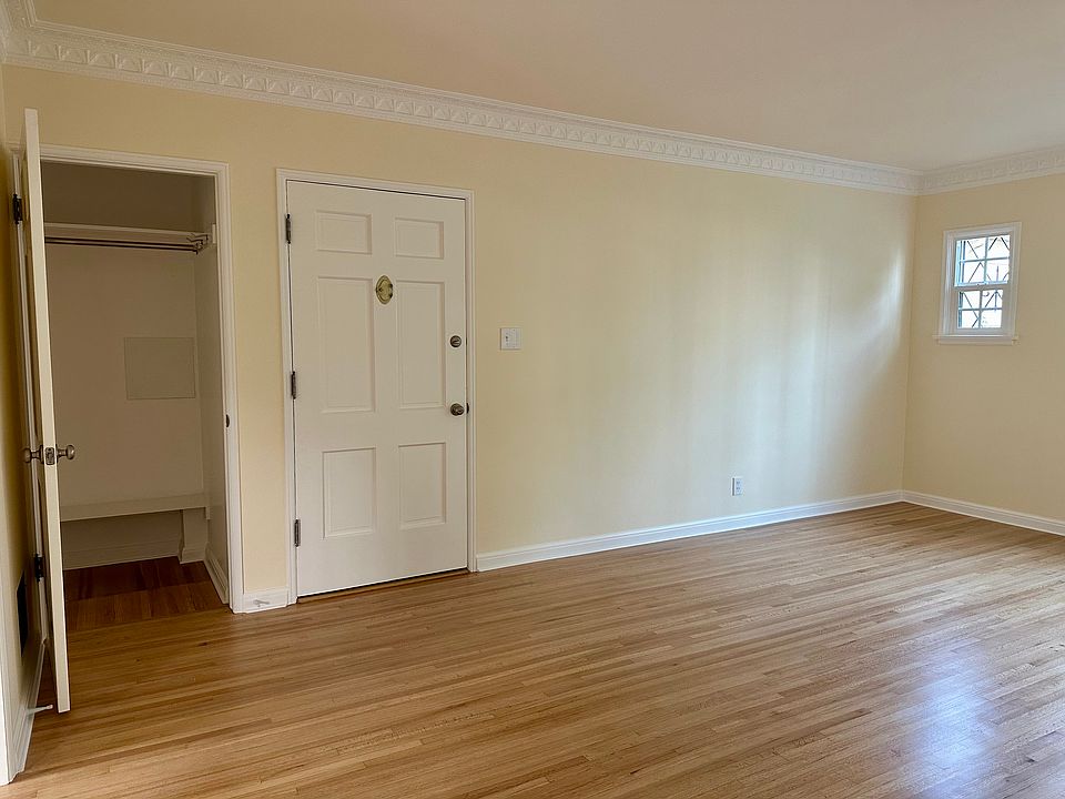 Living area - 3rd view - Walk in closet with a bench next to front door entrance