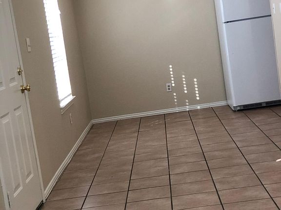 Kitchen, hall and bathrooms tile.