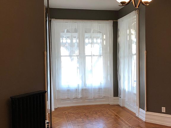 Living Room - with big beautiful windows and original wood floors