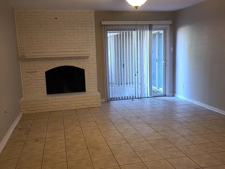 Den with working fireplace