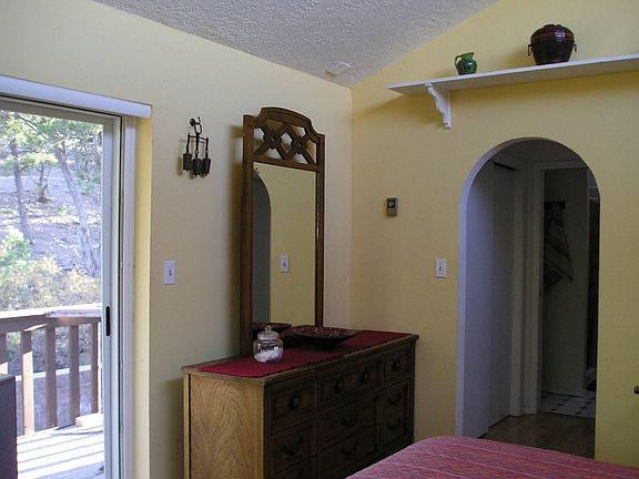 Master bedroom has deck & bath