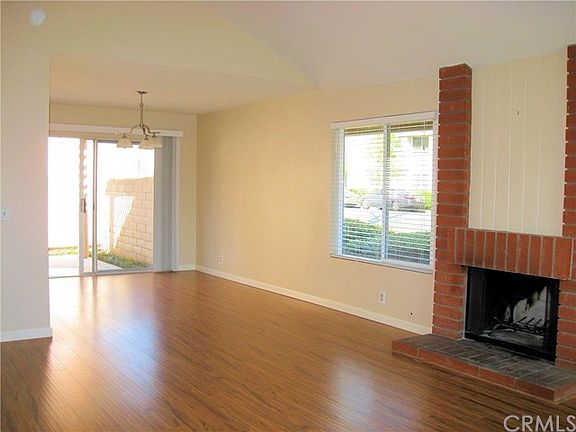 Greatroom with vaulted ceilings, and sliding glass doors from the dining area to the large rear pati