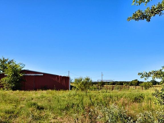 48  x  36 barn, with horse stalls, concrete floor, storage rooms and large sliding doors on each end