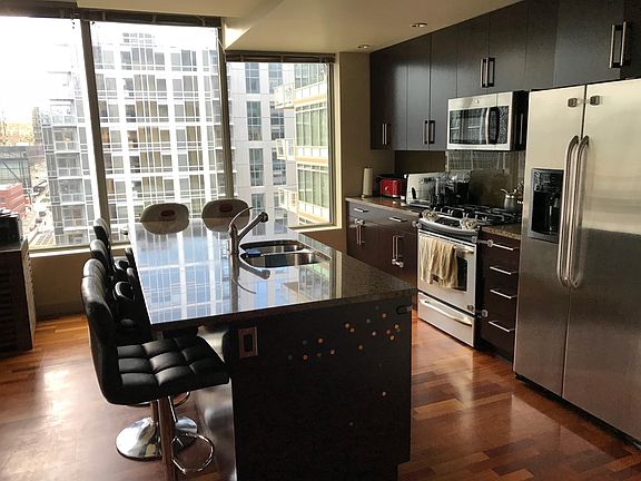 Expansive kitchen with lots of storage and gas cooktop. 