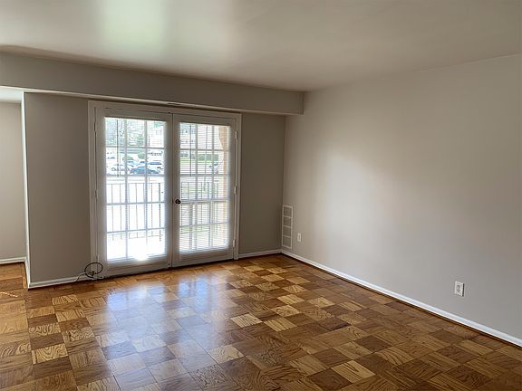 Double French doors leading out to private balcony looking out across Jackson Street.
