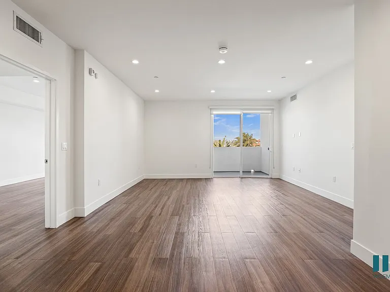 Open-Concept Dining and Living Room Areas with Patio