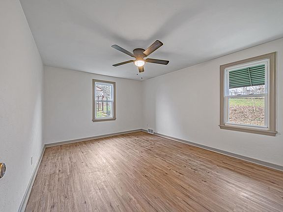 First floor master bedroom, lots of light and updated ceiling fan