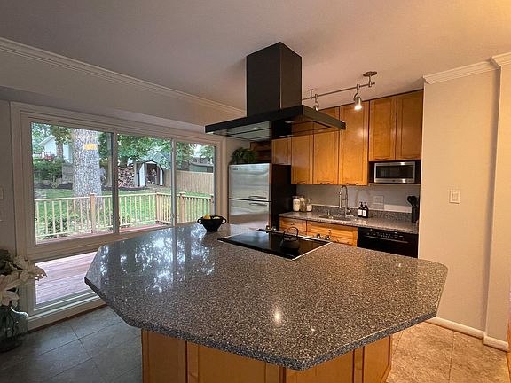 Spacious kitchen opens to living room.