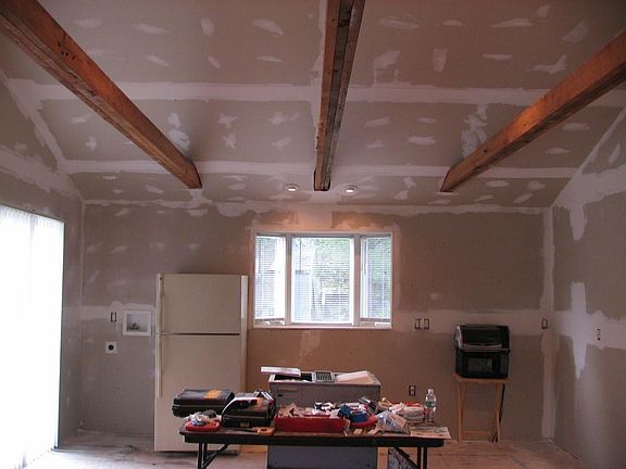 Refinished kitchen with new slider to deck and new bay window
