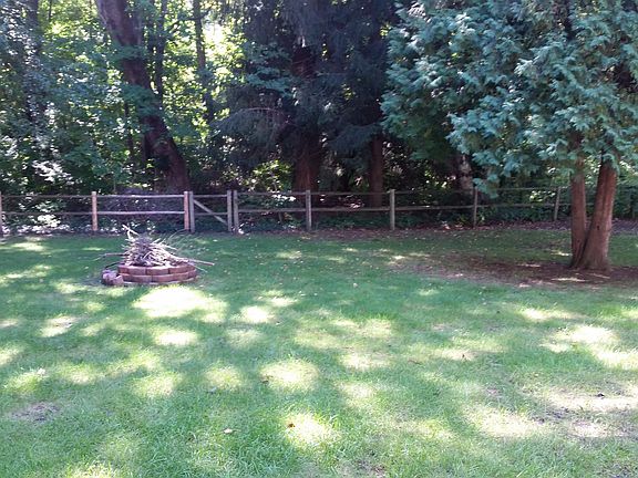 Yard backs up to woods.