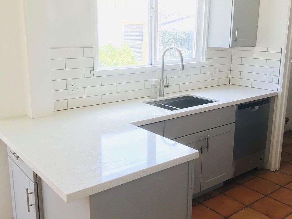 Bright kitchen featuring clean countertops, abundant natural light, and lovely Riviera views