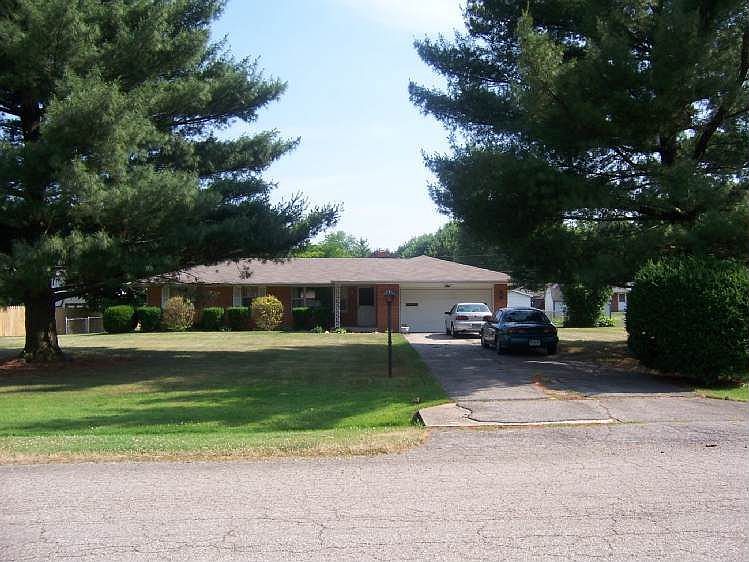 Great Curb appeal is accented by mature trees 