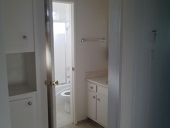 Bathroom, vanity with mirror outside the bathroom