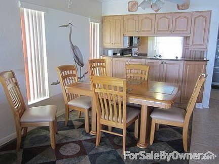 View of dining area .
						:
						Oak dining room set includes six chairs and table ( 2 leaves )