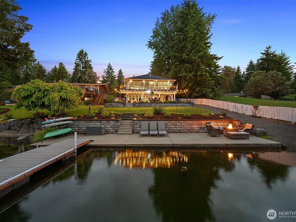 WELCOME to 7020 Holmes Island Rd SE in Olympia. Premium lakefront living on the desirable LONG LAKE with your own private boat launch!>