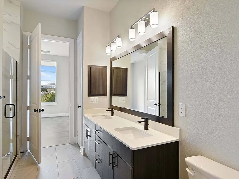 Refresh and rejuvenate in a clean, modern bathroom designed for your comfort.