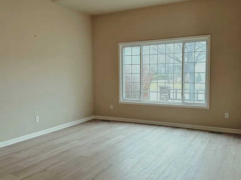 Living room has brand new wood floors!