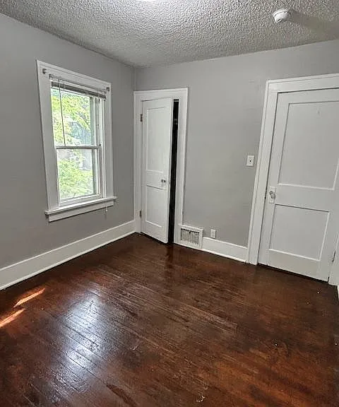 Bedroom #1. Looking at the door to the room and the closet.