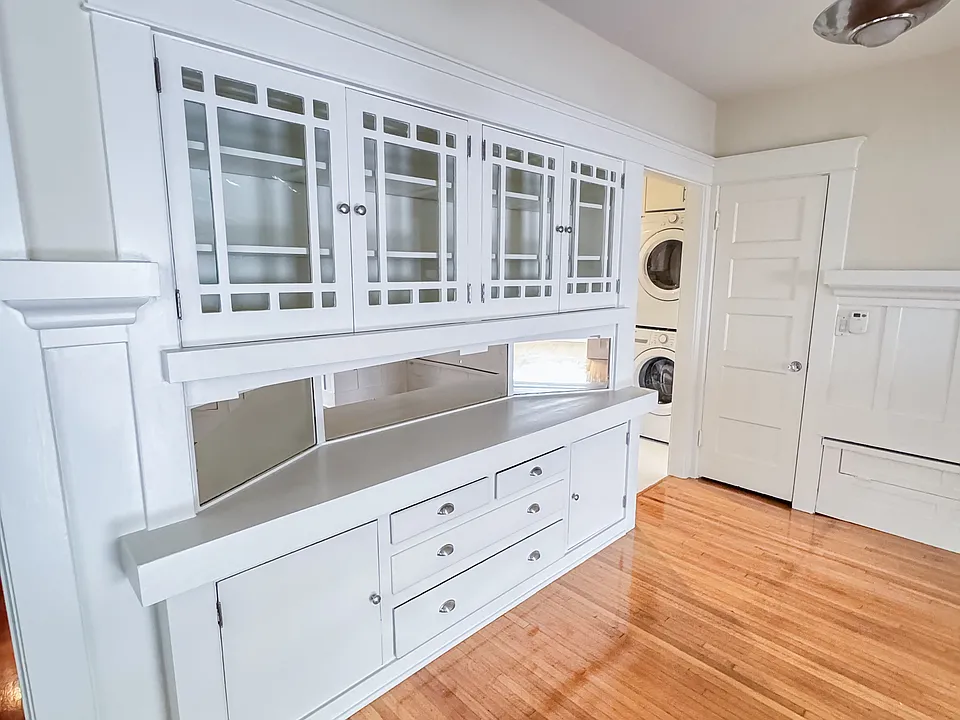 Original 1915 China Cabinet defines dining room.
