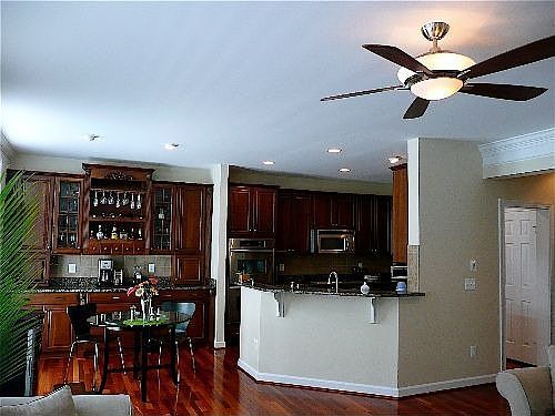 Kitchen w/ Built-in Stained & Glazed Cherry Hutch & Wine rack