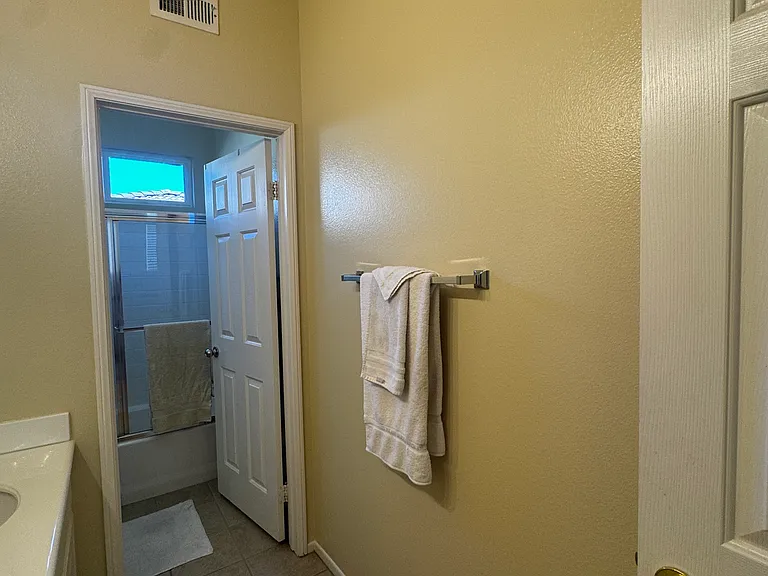 Bathroom space. Notice a 2nd door in bathroom separates the sink/vanity area from the toilet/shower area of bathroom for added privacy for sharing purposes.