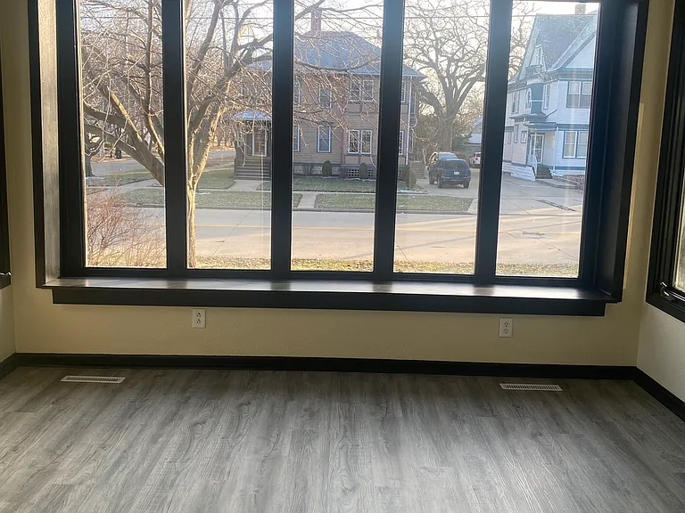 Front room with french doors off of the living room.. Sunny and spacious.