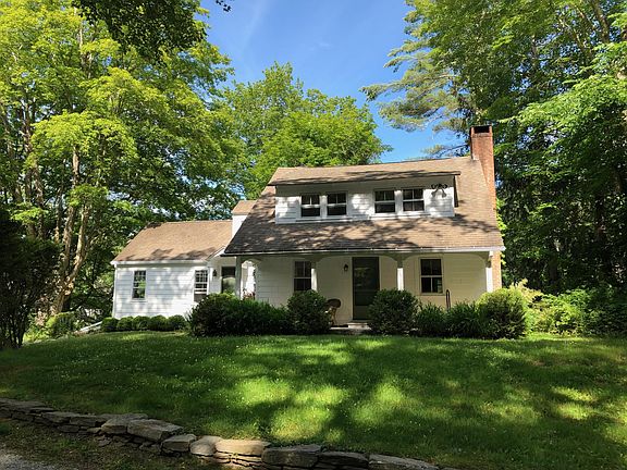 This is the front of the house. Hydrangeas and Shasta Dasies have been added to the flower beds.