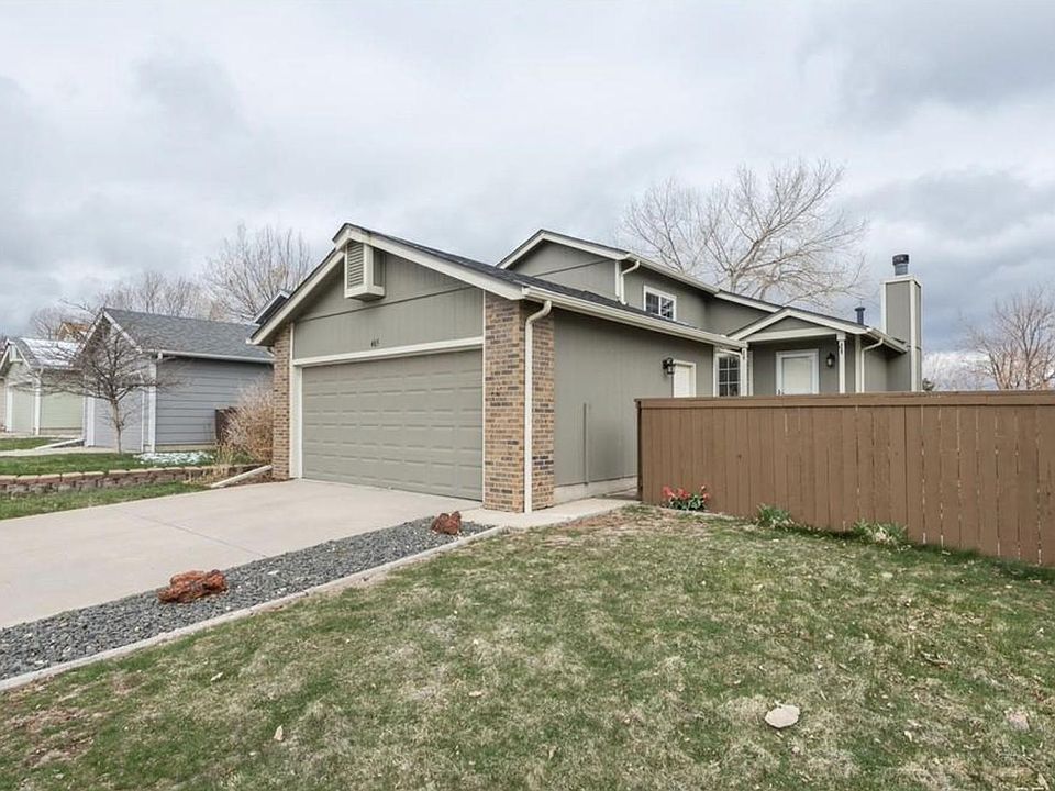 View from street - Front yard/fence and double garage door.
