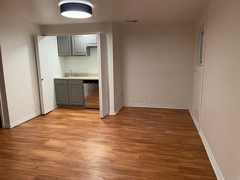 Basement bonus room with wet bar and small fridge