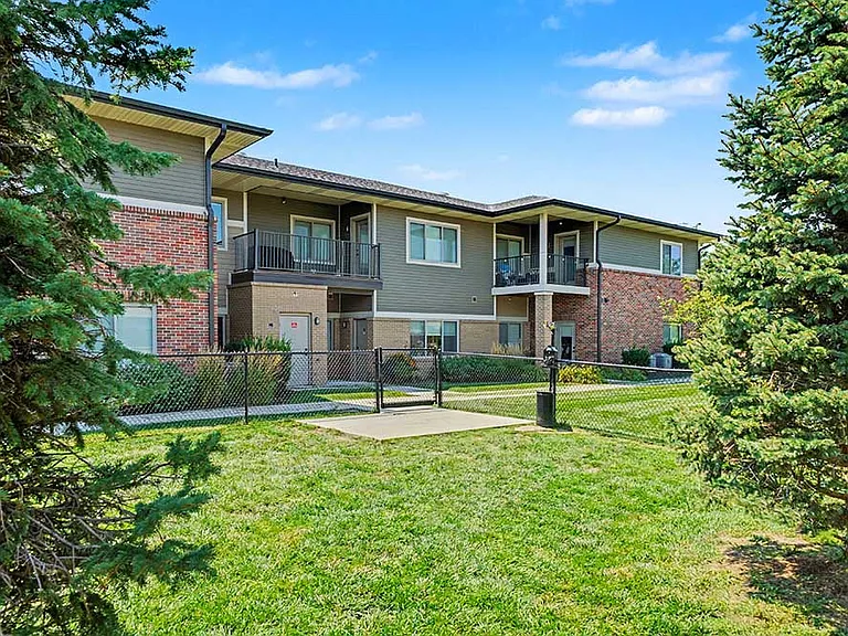 Fresh air and open green space create an easy routine for playtime, where pets can run freely while neighbors connect outdoors.