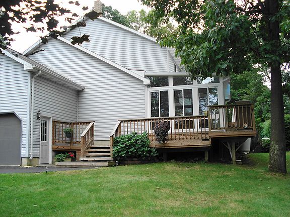 side of home with added sun room