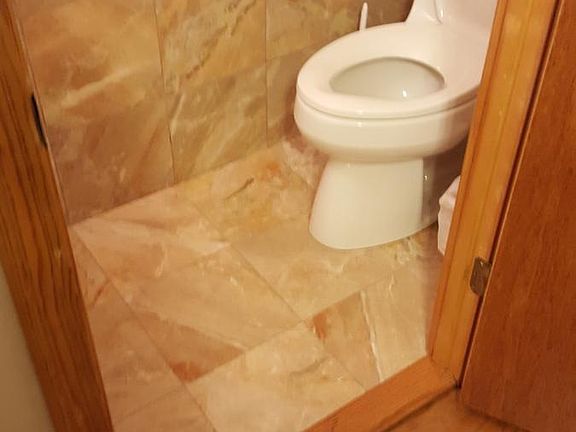 Marble half bath off Main Bedroom