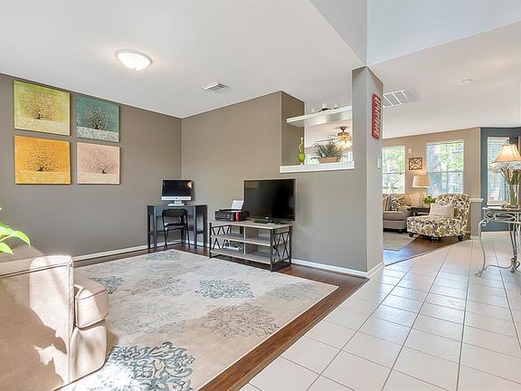 Abundant natural light fills the home with wooded views straight to the back yard from the front door. Initially built as a formal dining, the Extra Room to the left is a flexible space and can be used as additional living room, study, game room, or 