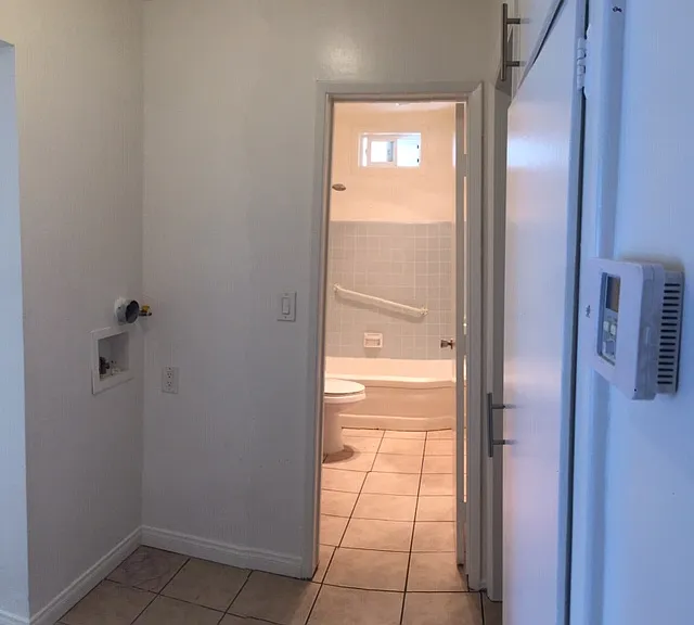 hall with linen closet and laundry hook-ups