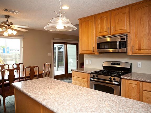 Great kitchen with tons of cabinets, island for additional workspace, stainless appliances with gas 