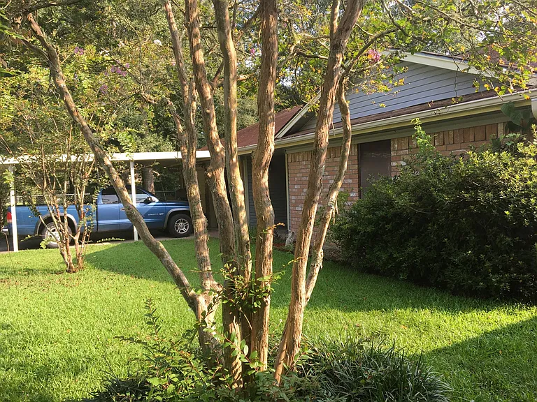 Front of home, covered double driveway double car garage