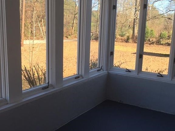 Enjoy your coffee in this sunroom.