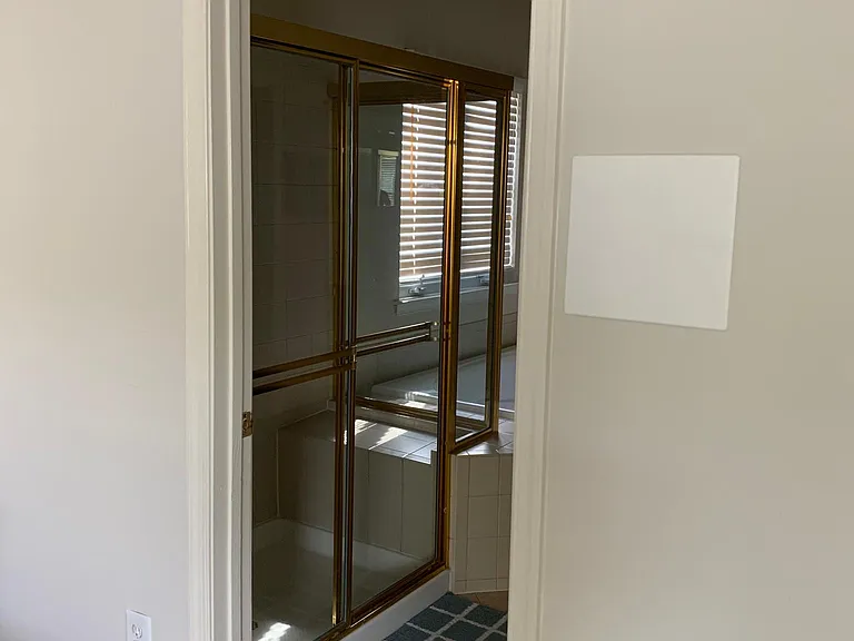 Master bathroom has walk-in shower and sauna tub