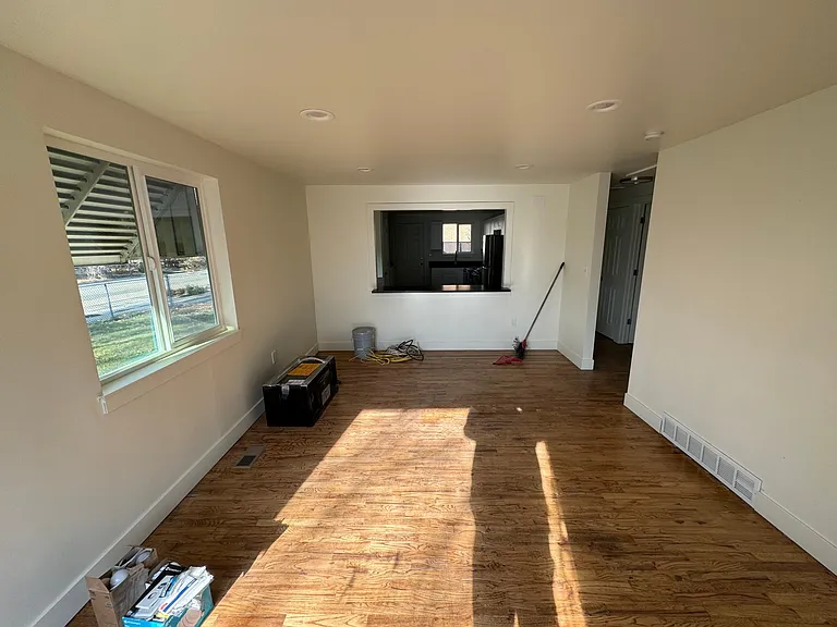 Hardwood floor in living room was newly refinished in 2024