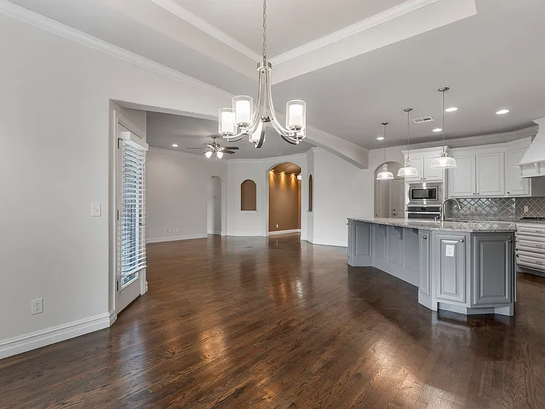 View from dining room to kitchen and living room