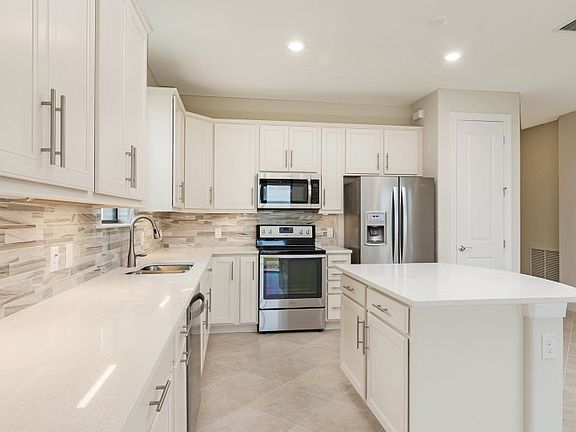 Kitchen with stainless steel appliances and maple cabinets
