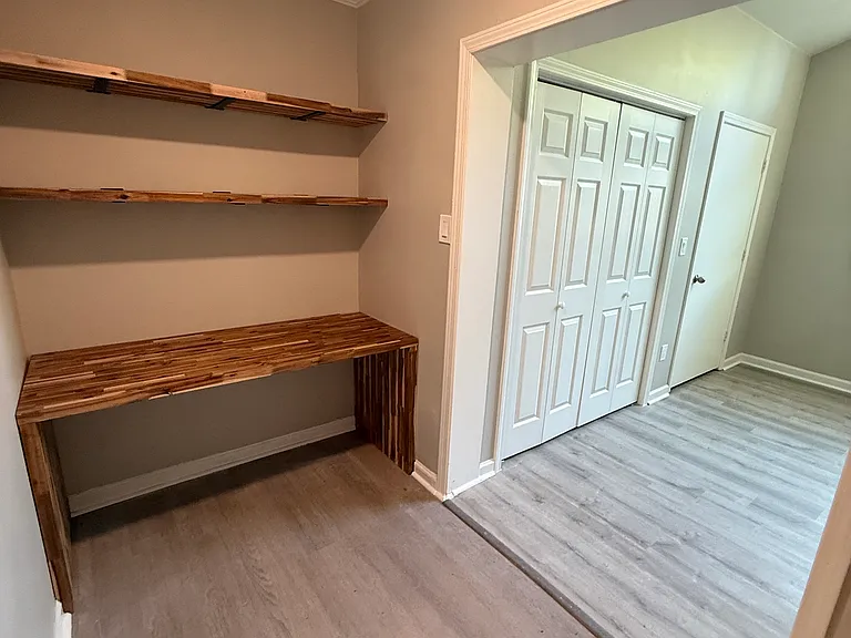 Office area/shelving near master bathroom