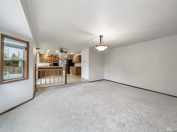 Brand-new carpet & wood-wrapped windows throughout. Here's a peek at even more cabinet & counterspace in the kitchen. 