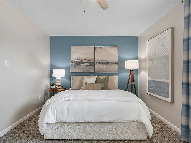 Cozy bedroom with carpet & ceiling fan