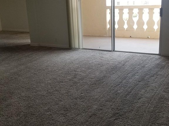 Living/Dining Room with sliding glass doors to balcony
15' 9" by 19'