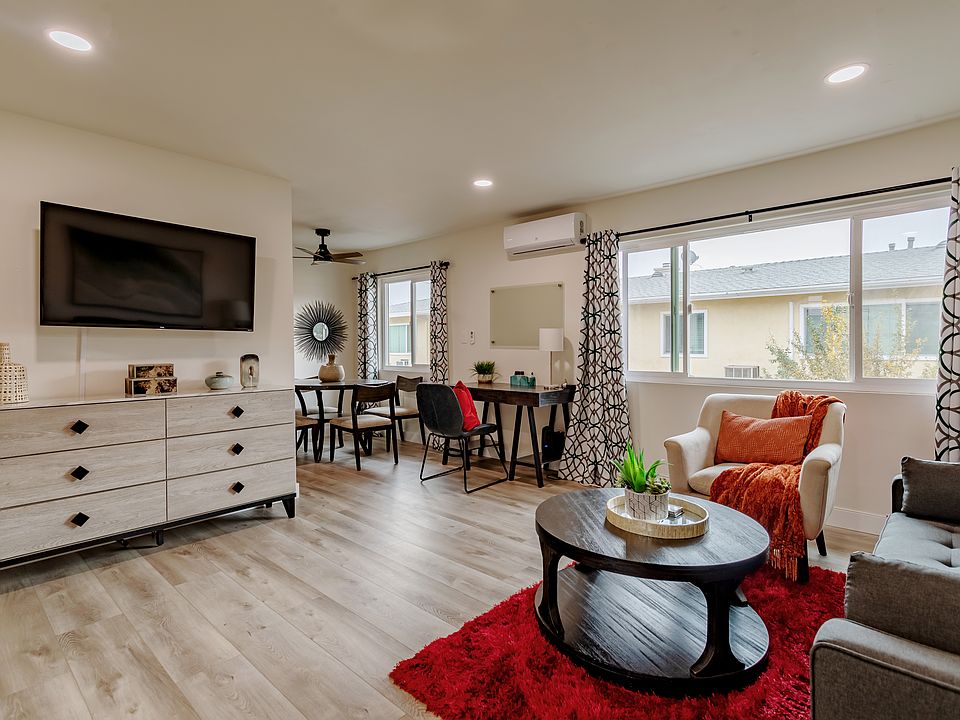 Living room with more storage space and 55" smart TV.